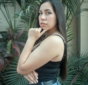 a-woman-in-a-black-top-is-posing-for-a-picture.jpg a woman in a black top is posing for a picture